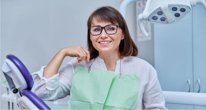 Patient Enjoying the Benefits of Durable Dental Crowns and Bridges Treatment in Mentor